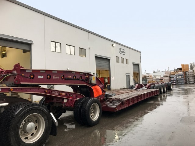 Burgundy lowbed and gooseneck at the Pacesetter yard on pickup day.