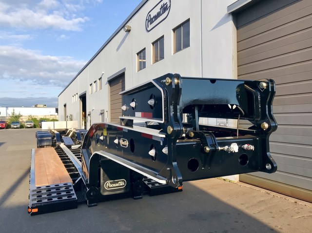 Front view of the black and white gooseneck and deck assembly.