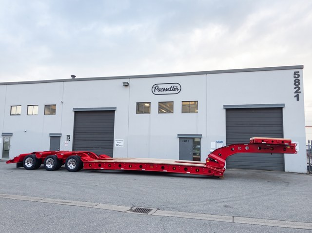 Side profile of the all-red lowbed at the Pacesetter yard.