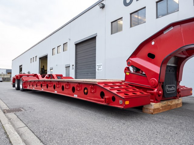 Close view along the all-red deck frame toward the gooseneck.