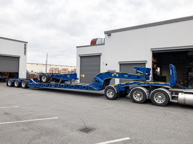 Blue Trombone extension frame and wheel assembly carried on a customer lowbed.
