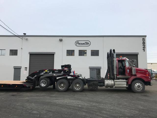 Black 55 ton lowbed with red pinstriping and a single axle pin-on booster at the Pacesetter yard, photo 1 of 14