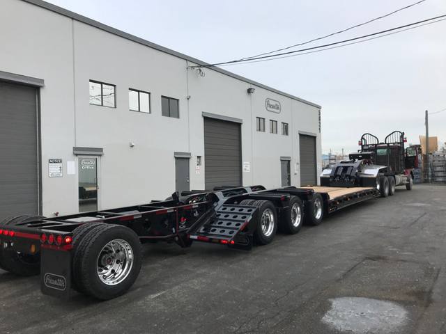 Black 55 ton lowbed with red pinstriping and a single axle pin-on booster at the Pacesetter yard, photo 5 of 14