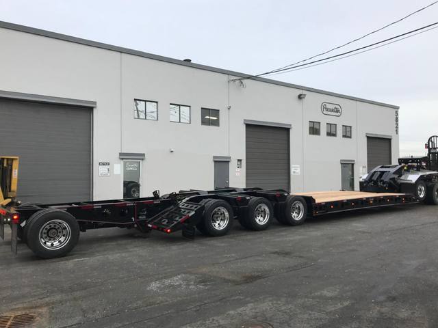 Black 55 ton lowbed with red pinstriping and a single axle pin-on booster at the Pacesetter yard, photo 6 of 14