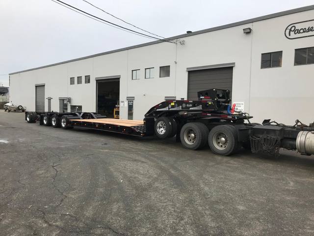Black 55 ton lowbed with red pinstriping and a single axle pin-on booster at the Pacesetter yard, photo 8 of 14