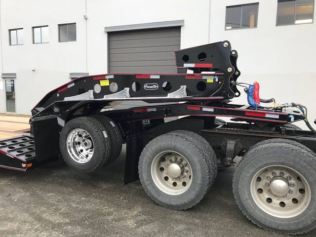 Black 55 ton lowbed with red pinstriping and a single axle pin-on booster at the Pacesetter yard, photo 14 of 14