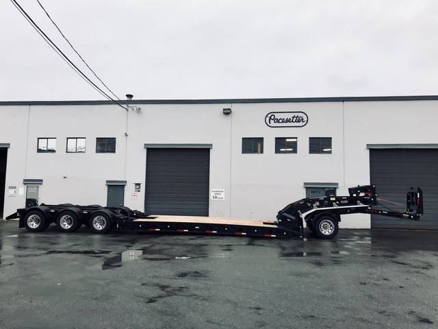 Black 60 ton lowbed with neck axle and tridem rear on a rainy day at the Pacesetter yard, photo 2 of 9