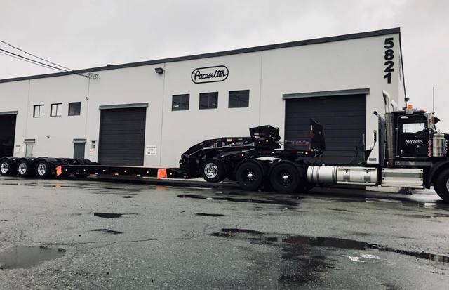 Black 60 ton lowbed with neck axle and tridem rear on a rainy day at the Pacesetter yard, photo 5 of 9