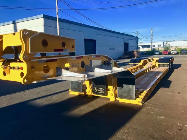 Yellow 60 ton lowbed with black fenders and a pin-on booster at the Pacesetter yard, photo 3 of 11