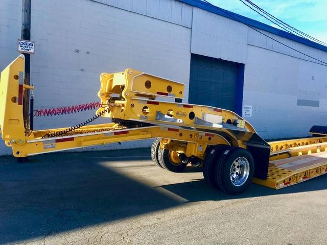 Yellow 60 ton lowbed with black fenders and a pin-on booster at the Pacesetter yard, photo 4 of 11