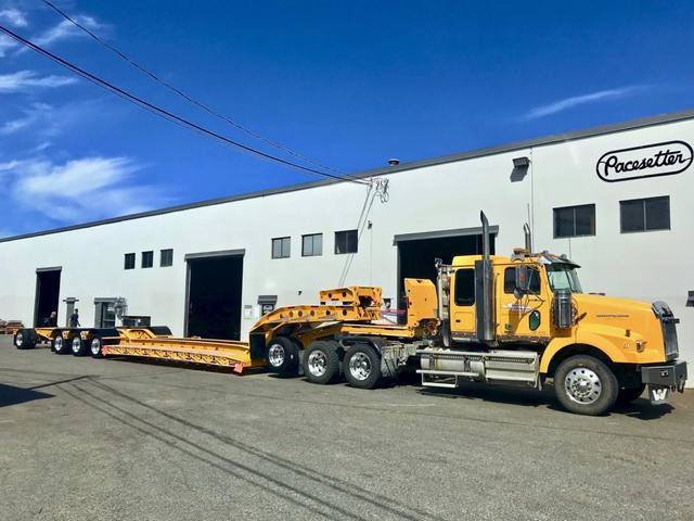 Yellow 60 ton lowbed with black fenders and a pin-on booster at the Pacesetter yard, photo 9 of 11