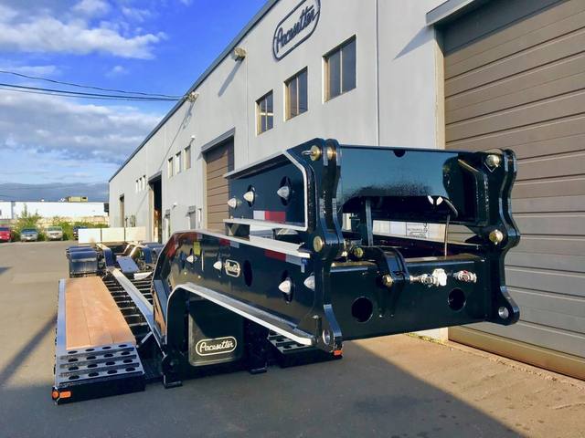 Black 65 ton lowbed with full fenders and white pinstripe edging on a sunny day, photo 6 of 7