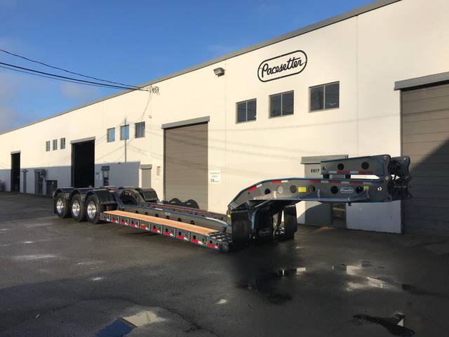 Charcoal 75 ton lowbed with light blue pinstriping and its two axle nitrogen booster, photo 1 of 26