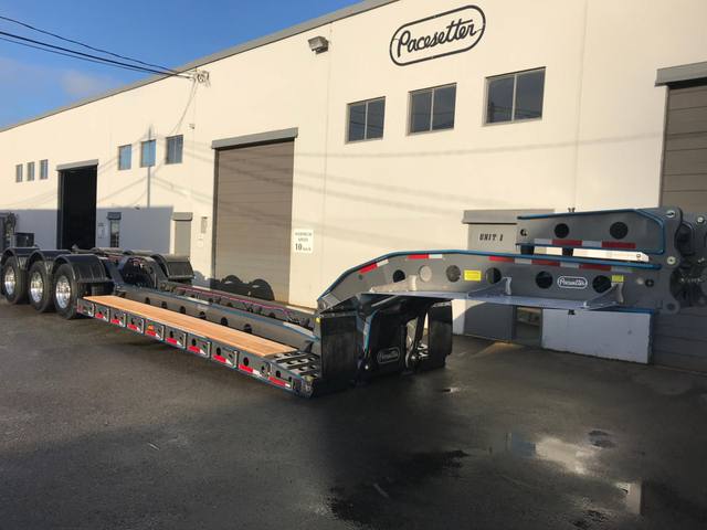 Charcoal 75 ton lowbed with light blue pinstriping and its two axle nitrogen booster, photo 2 of 26