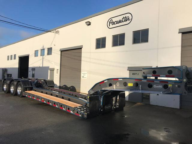 Charcoal 75 ton lowbed with light blue pinstriping and its two axle nitrogen booster, photo 3 of 26