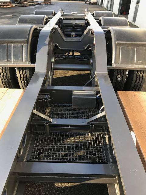 Charcoal 75 ton lowbed with light blue pinstriping and its two axle nitrogen booster, photo 8 of 26