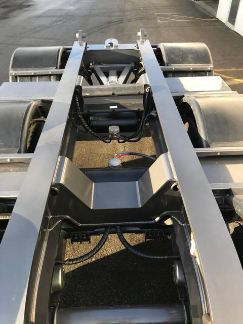 Charcoal 75 ton lowbed with light blue pinstriping and its two axle nitrogen booster, photo 9 of 26
