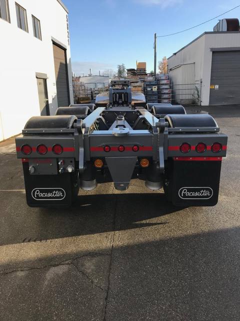 Charcoal 75 ton lowbed with light blue pinstriping and its two axle nitrogen booster, photo 10 of 26