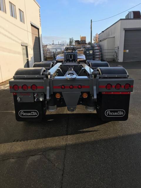 Charcoal 75 ton lowbed with light blue pinstriping and its two axle nitrogen booster, photo 11 of 26