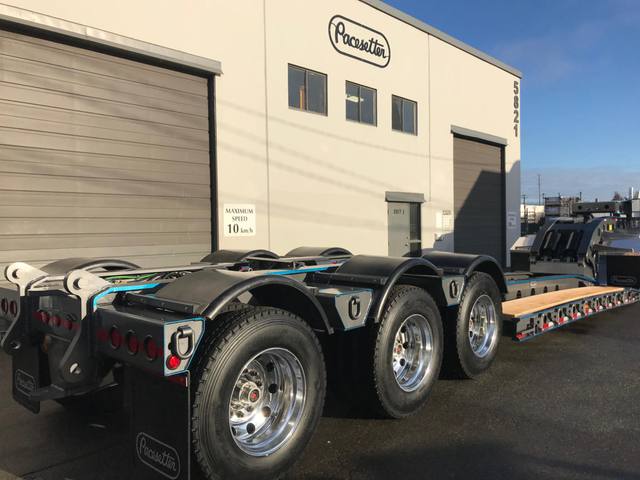 Charcoal 75 ton lowbed with light blue pinstriping and its two axle nitrogen booster, photo 13 of 26