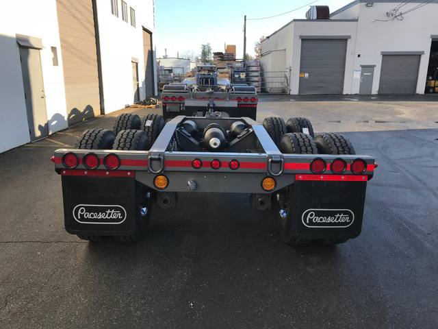 Charcoal 75 ton lowbed with light blue pinstriping and its two axle nitrogen booster, photo 15 of 26