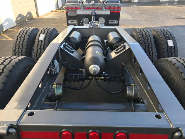Charcoal 75 ton lowbed with light blue pinstriping and its two axle nitrogen booster, photo 17 of 26