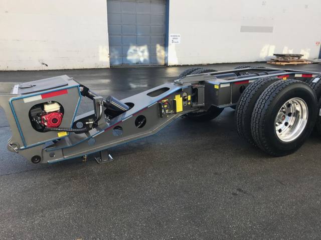 Charcoal 75 ton lowbed with light blue pinstriping and its two axle nitrogen booster, photo 18 of 26