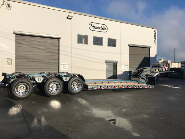 Charcoal 75 ton lowbed with light blue pinstriping and its two axle nitrogen booster, photo 21 of 26