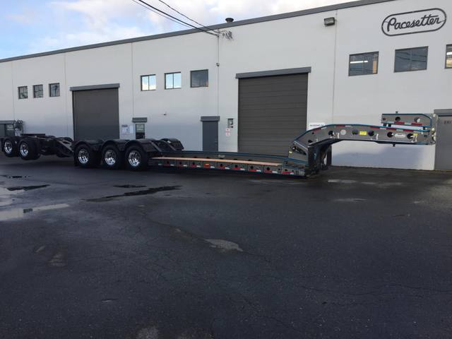 Charcoal 75 ton lowbed with light blue pinstriping and its two axle nitrogen booster, photo 24 of 26