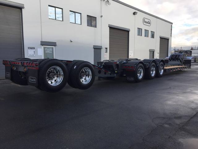 Charcoal 75 ton lowbed with light blue pinstriping and its two axle nitrogen booster, photo 25 of 26