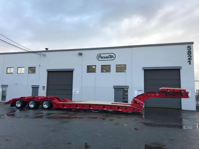 Red 75 ton lowbed with folding rear ramps at the Pacesetter yard, photo 1 of 12