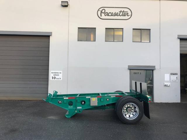 Green single axle fish mouth booster with raised coupling arms at the Pacesetter yard, photo 1 of 9