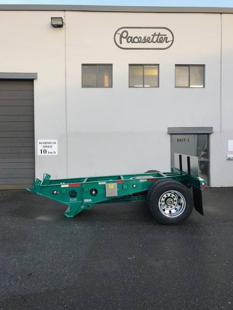 Green single axle fish mouth booster with raised coupling arms at the Pacesetter yard, photo 2 of 9