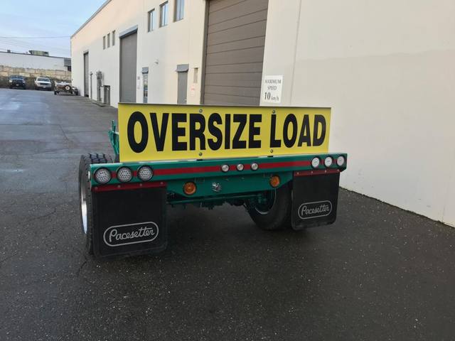 Green single axle fish mouth booster with raised coupling arms at the Pacesetter yard, photo 5 of 9