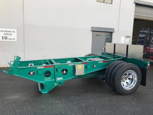 Green single axle fish mouth booster with raised coupling arms at the Pacesetter yard, photo 8 of 9