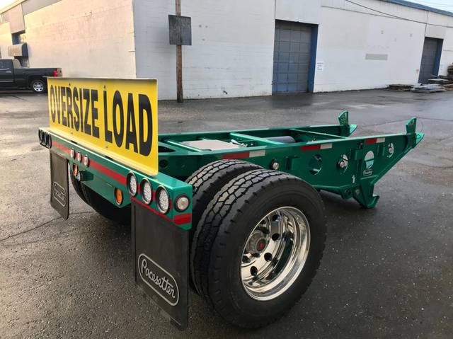 Green single axle fish mouth booster with raised coupling arms at the Pacesetter yard, photo 9 of 9